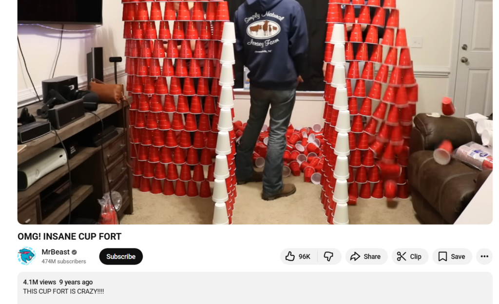 MrBeast строит крепость из пластиковых стаканчиков